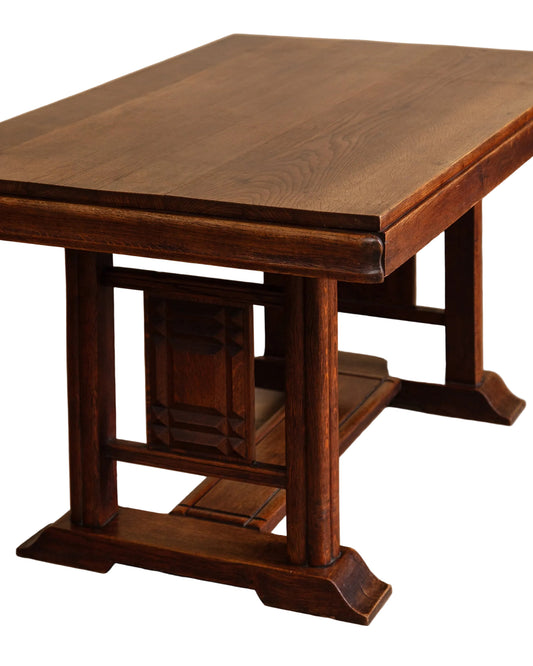 Wooden table with a warm brown finish on a wooden floor.
