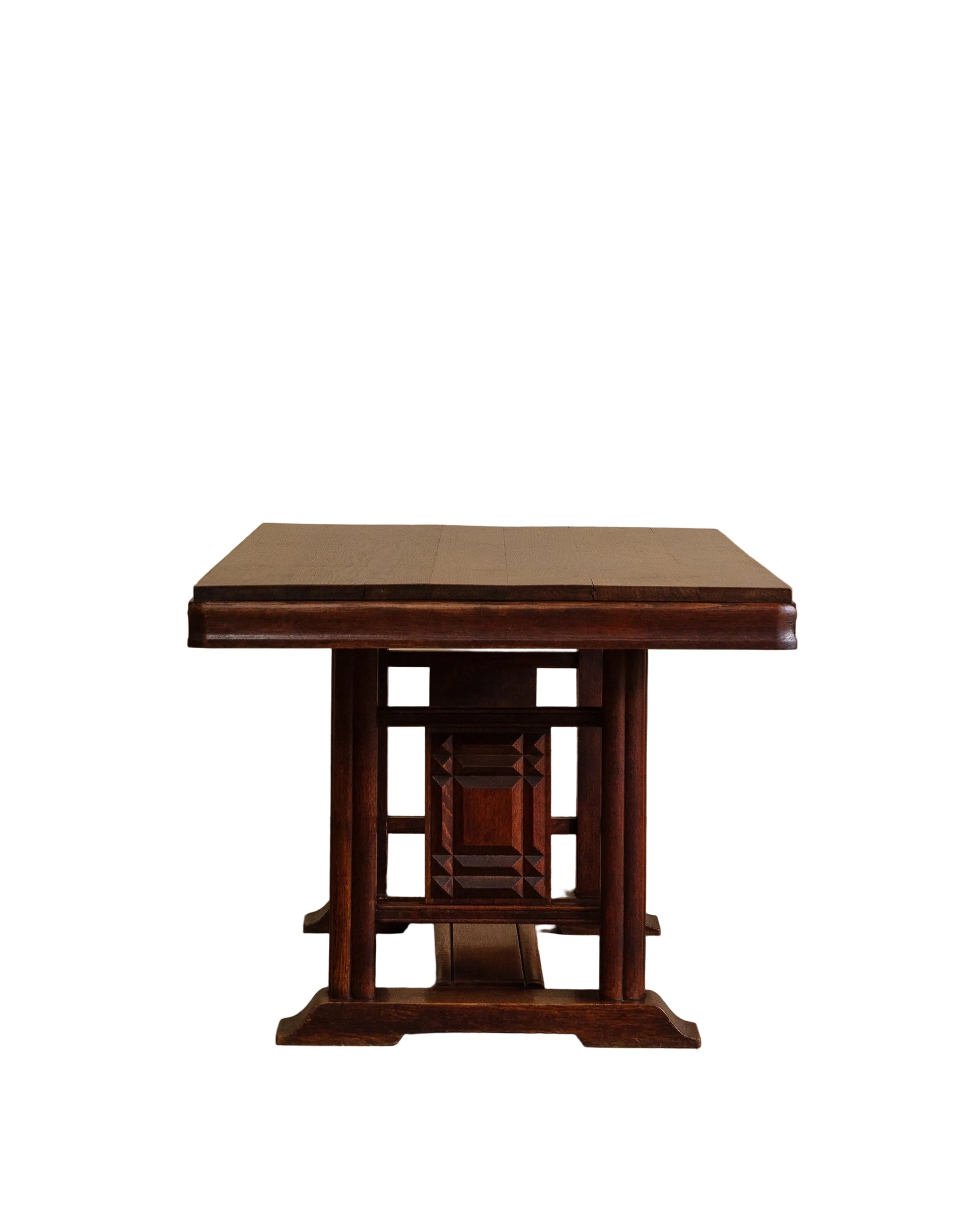 Wooden table with a textured surface on a wooden floor and beige wall background