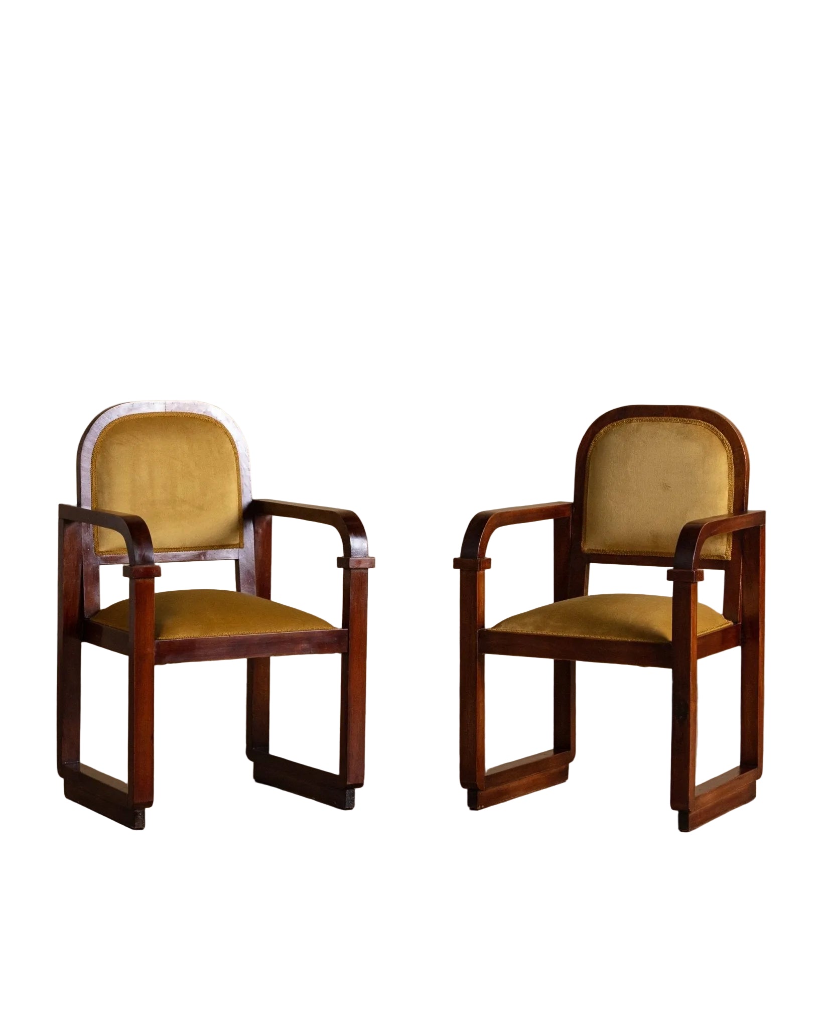 Two wooden chairs with yellow cushions on a beige background