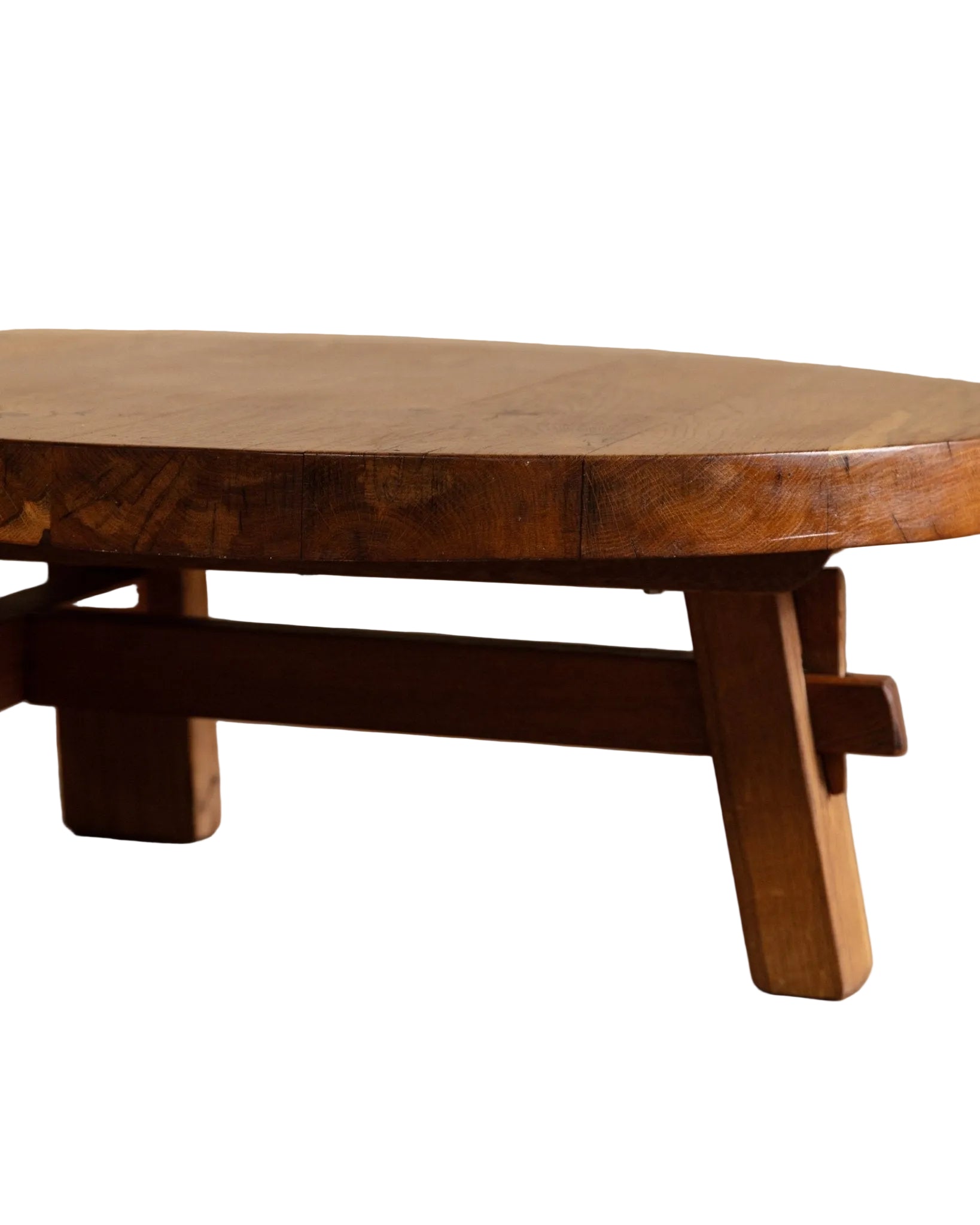 Wooden table with a rustic design on a wooden floor.