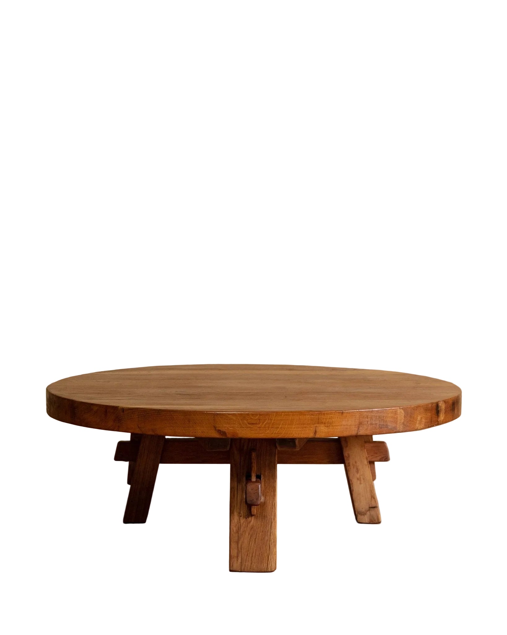Round wooden table with a rustic design on a beige background