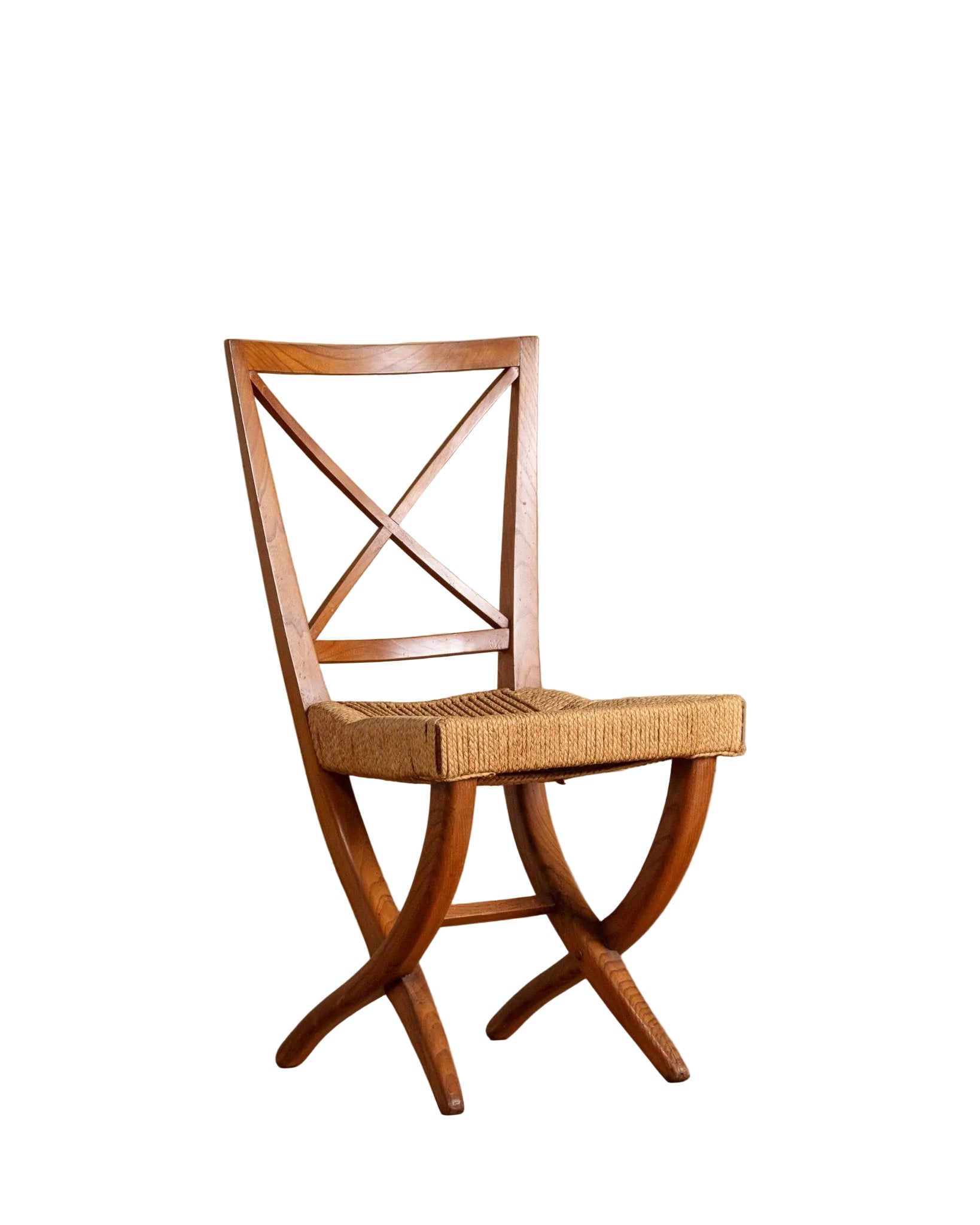 Wooden chair with woven seat on a wooden floor and beige wall background