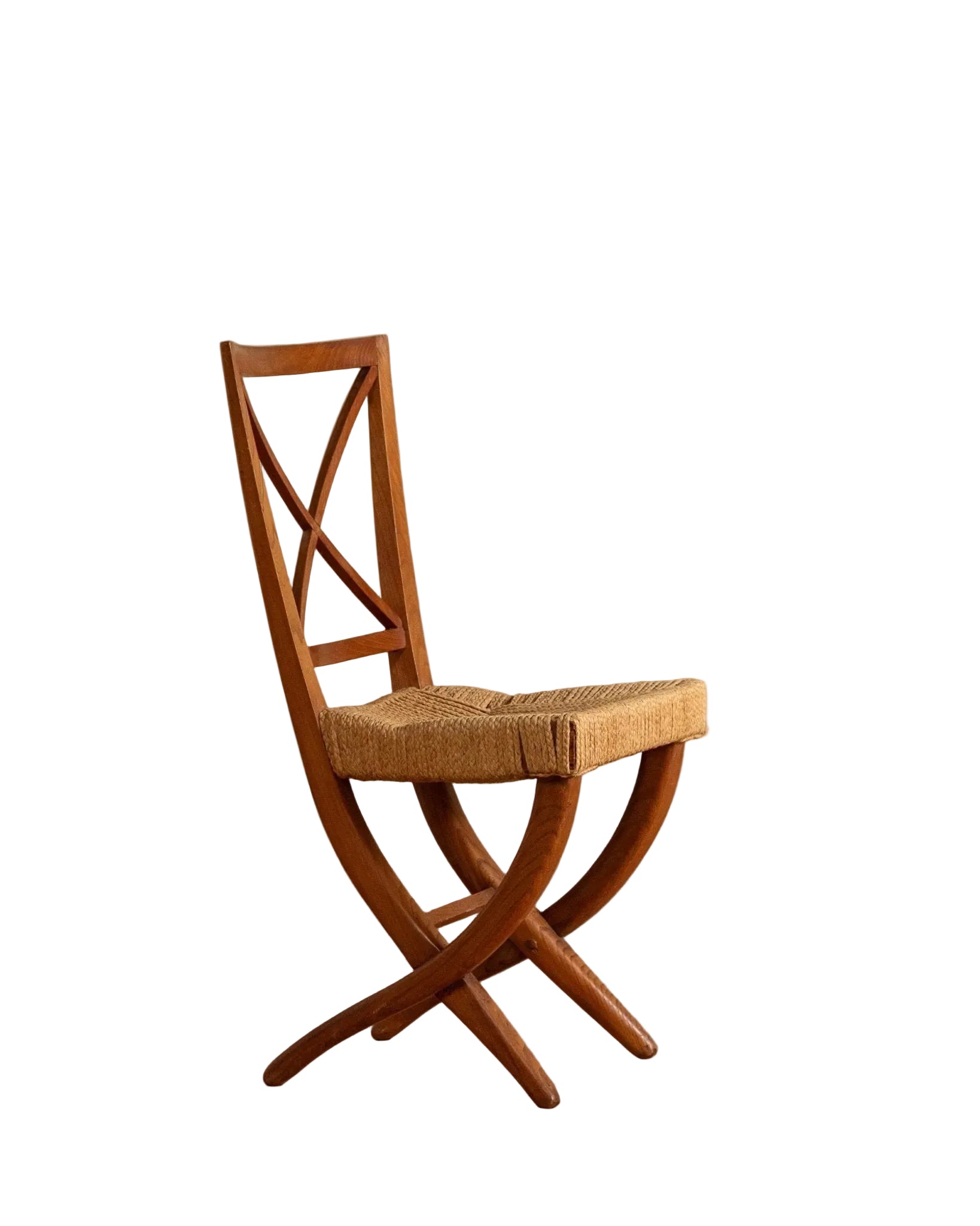 Wooden chair with woven seat on a wooden floor and beige wall background