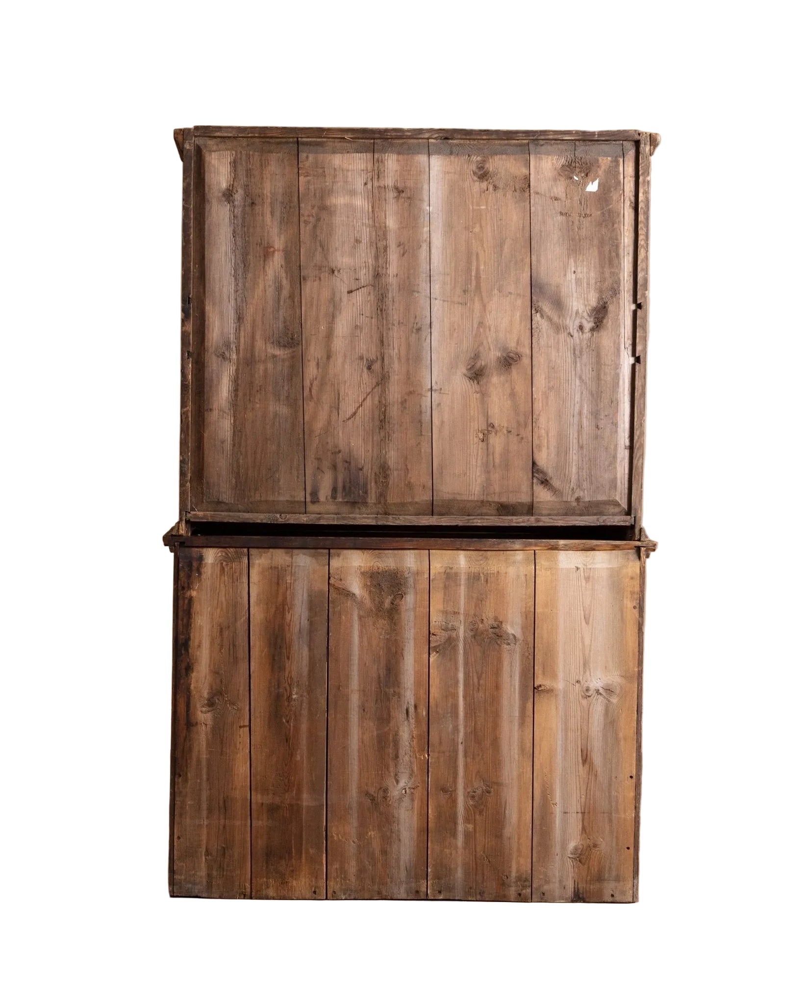 Two stacked wooden crates on a wooden floor with a beige wall background