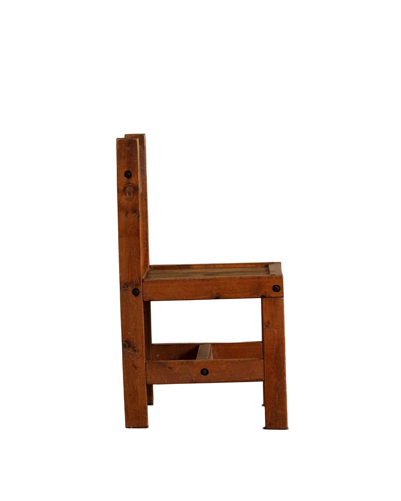 Wooden chair on a wooden floor with a beige wall background